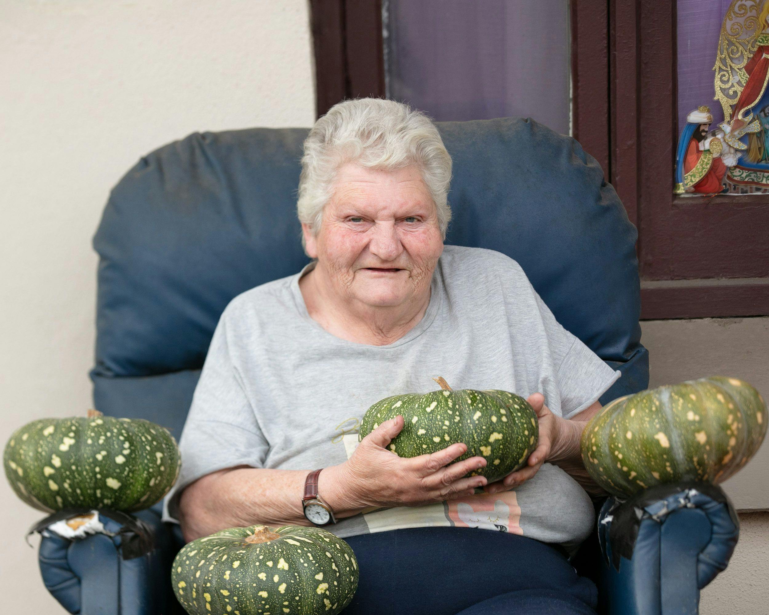 Woman holding pumpkins